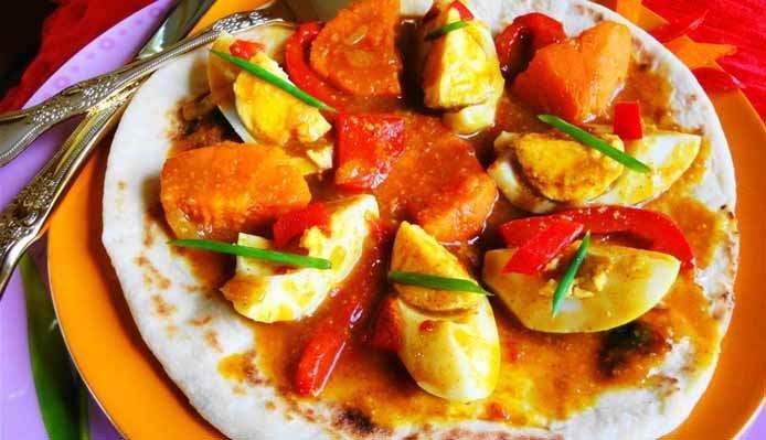 Afbeelding van recept met Sandhia's Roti met eieren en zoete aardappel in masala